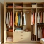 Capsule wardrobe creative flat lay with colorful blazer, printed scarf, statement jewelry and versatile clothing pieces